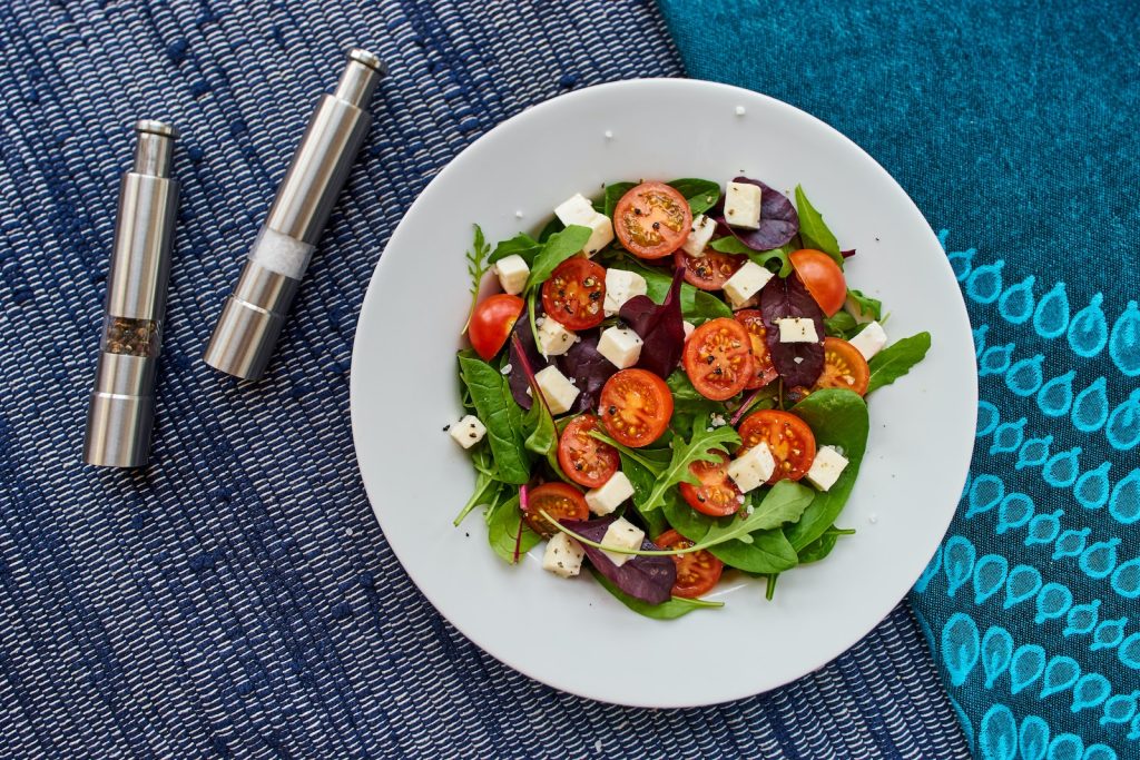 vegetable salad on round white ceramic plate